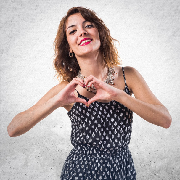 Pretty girl making a heart with her hands - Photo, Image
