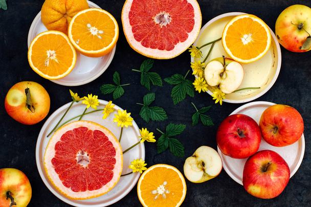 Mixed festive colorful tropical and citrus fruit sliced over bla - Foto, Bild