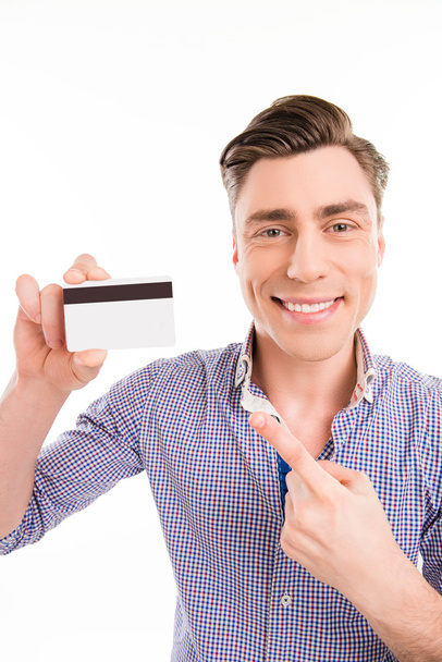 Portrait of happy young man pointing on bank card - Фото, изображение