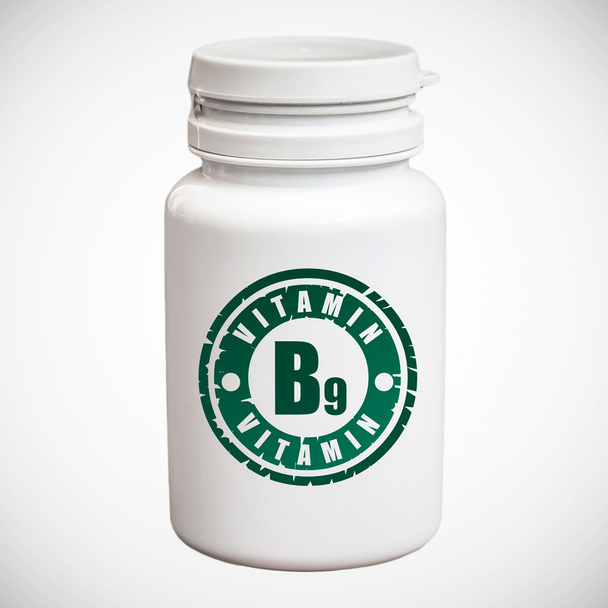 Fles pillen met vitamine B9 - Foto, afbeelding