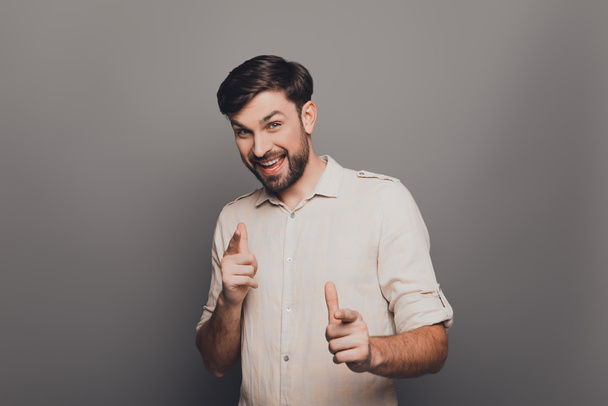 Portrait of handsome smiling young businessman  pointing on came - Photo, Image