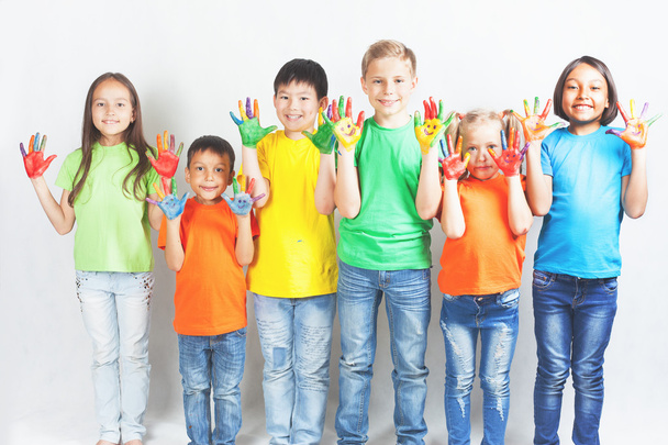 Happy kids with painted hands smiling - Fotó, kép