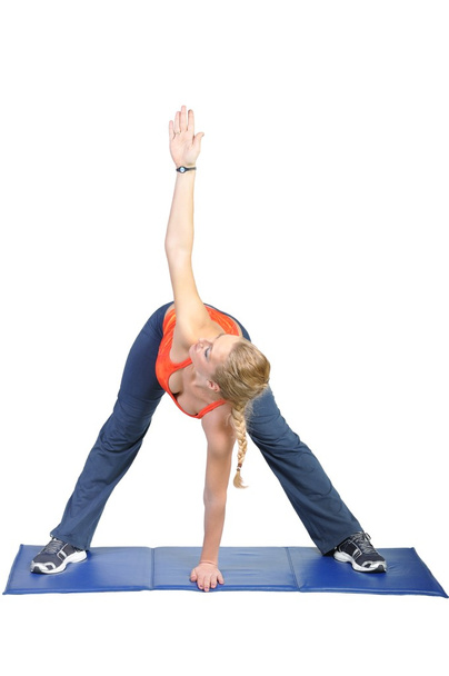 Fit young female yoga instructor showing different exercises on a white background - Φωτογραφία, εικόνα