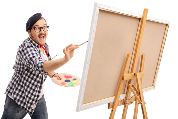 Excited artist painting on a canvas  - Foto, Bild