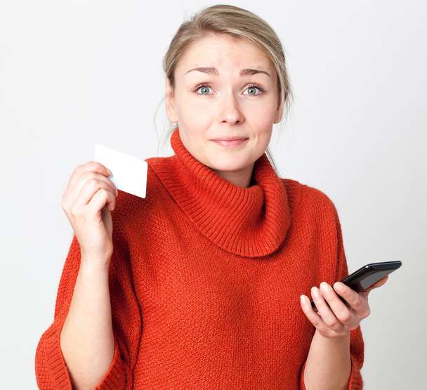 surprised young blond woman paying online with copy space credit card for modern convenience - Foto, Imagem
