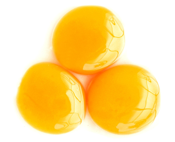 Три яєчні жовтки крупним планом
 - Фото, зображення