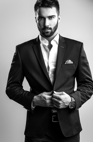 Elegant young handsome man. Black-white studio fashion portrait.  - Фото, зображення