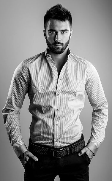 Elegant young handsome man. Black-white studio fashion portrait.  - Foto, afbeelding