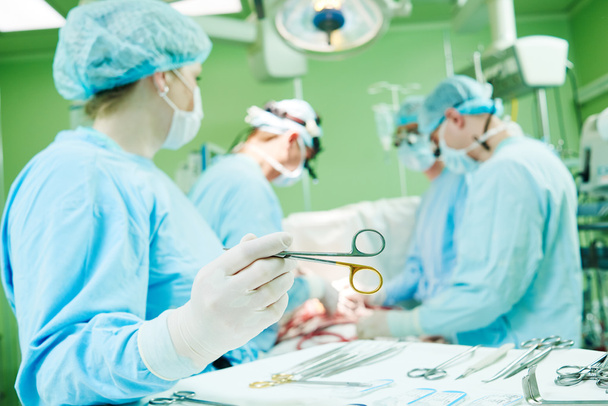 surgeons at work. female nurse operating in child surgery hospital - Fotografie, Obrázek