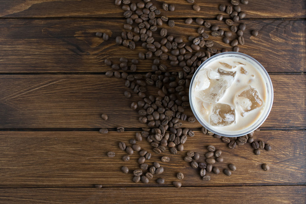 Ice coffee on wooden background - Foto, afbeelding