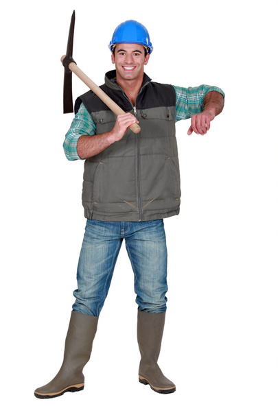 Worker holding ax - Фото, изображение