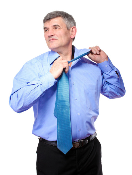Businessman taking a tie isolated on white - Fotografie, Obrázek