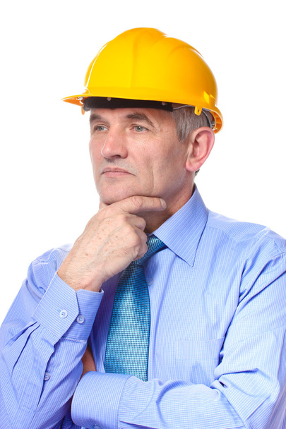 Man architect with helmet isolated on white - Фото, изображение