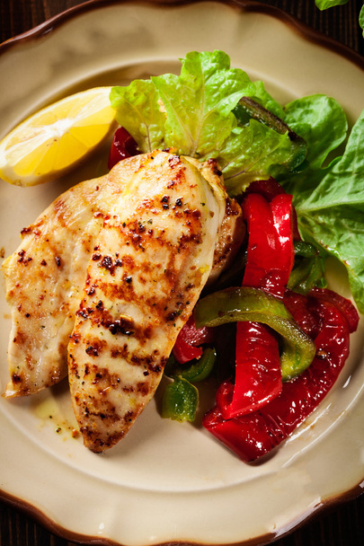 Grilled chicken breasts served with grilled paprika - Photo, Image