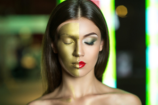 Woman with golden part of face - 写真・画像