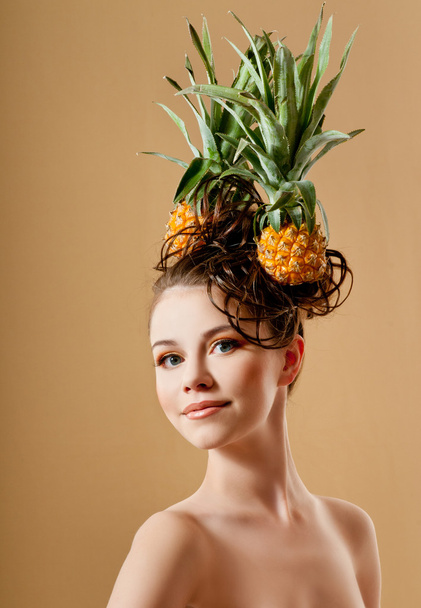 Beautiful woman with a pineapples - Zdjęcie, obraz