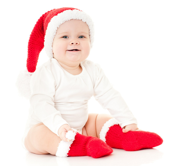Christmas child in a red hat - Photo, image