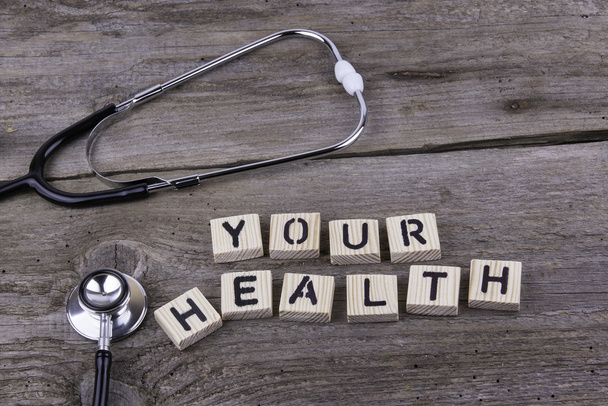Tekst: Uw gezondheid van houten letters op houten achtergrond - Foto, afbeelding