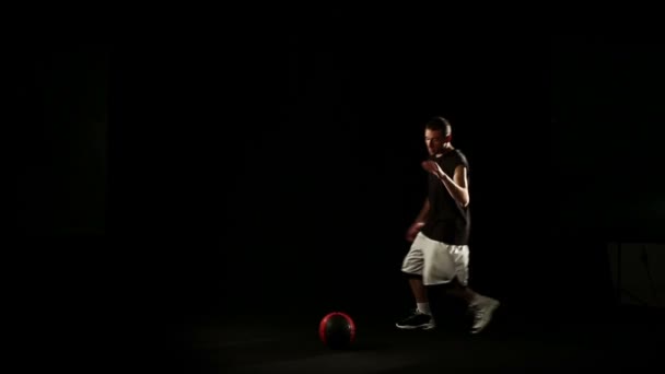 sportsman perform basketball freestyle trick - Footage, Video