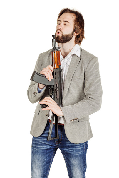 man holding a machine gun  - Foto, Bild