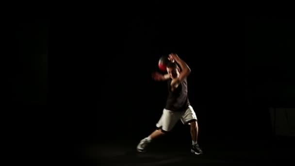 sportsman perform basketball freestyle trick - Footage, Video