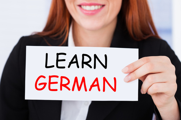 Businesswoman Holding Learn German Card - Fotoğraf, Görsel