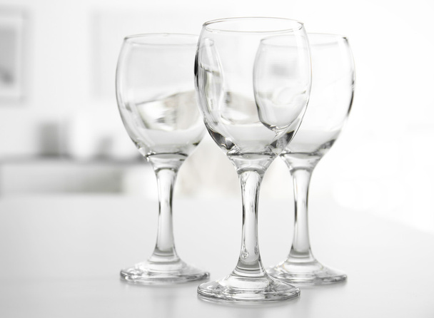 Wineglasses on blurred interior  - Foto, afbeelding
