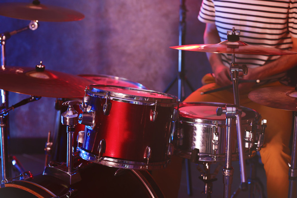 Drummer playing on drum set - Фото, зображення