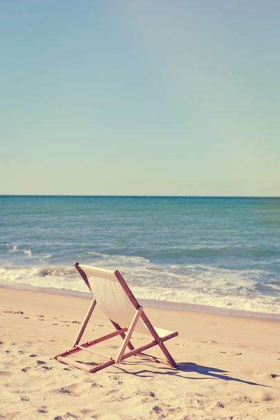 Beautiful beach landscape with chair for relaxation. Travel background - Zdjęcie, obraz