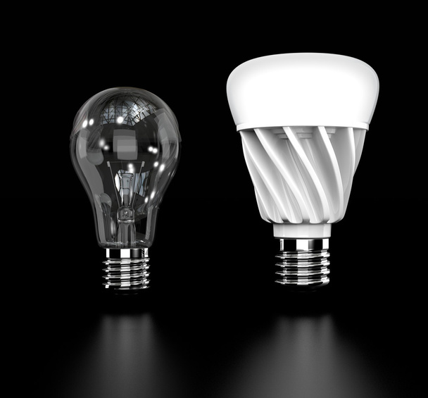 Lampadina a incandescenza e lampadina a LED isolate su fondo nero
 - Foto, immagini