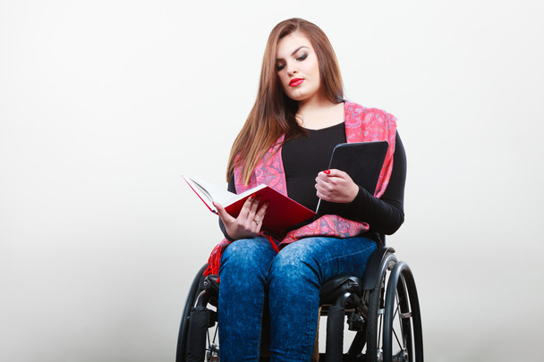 Disabled student with tablet ebook. - Фото, изображение