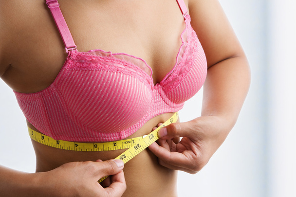 Woman measuring breast band size - Zdjęcie, obraz