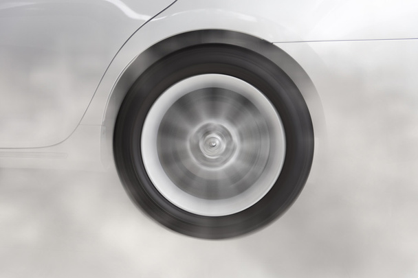 drifting and smoking wheel of new white car - Photo, Image