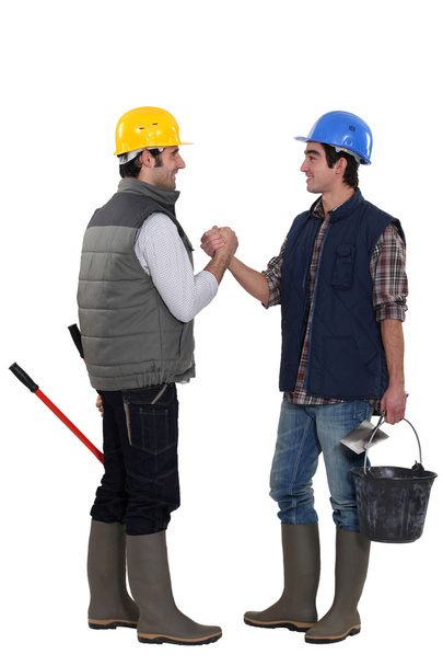 Two construction workers greeting each other - Фото, зображення