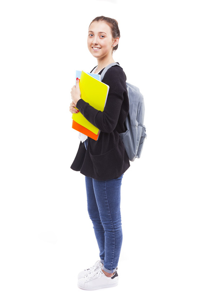 student girl holding colorful notebooks - Fotó, kép