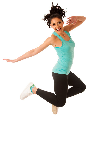 Happy fit and slim woman dancing and jumping isolated over white - Valokuva, kuva