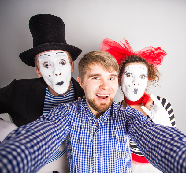A young man and Funny couple of mimes taking a selfie photo - Photo, Image