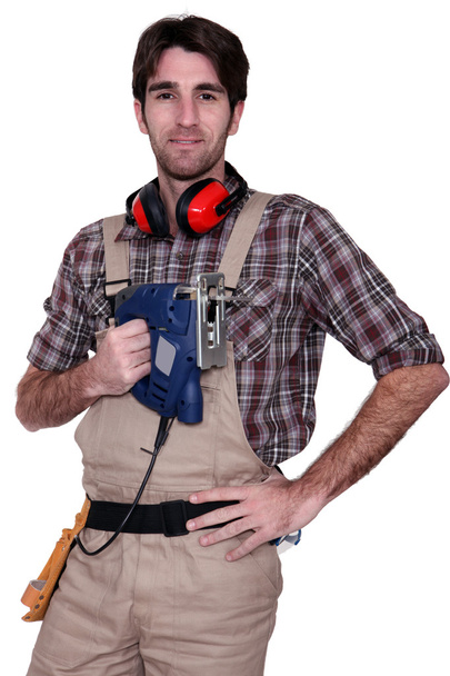 Man with an electric saw - Photo, Image