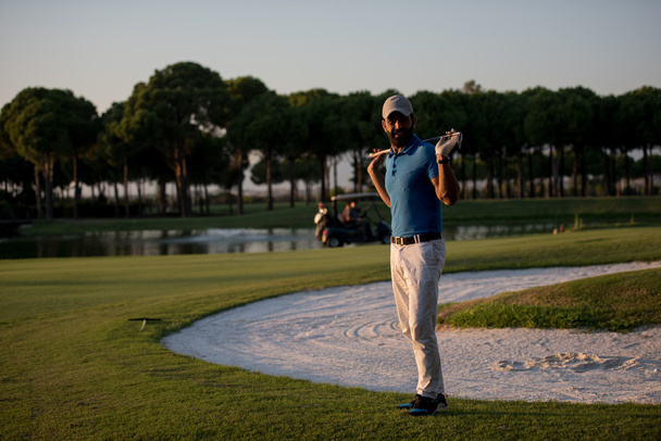 golfer  portrait at golf course on sunset - Zdjęcie, obraz