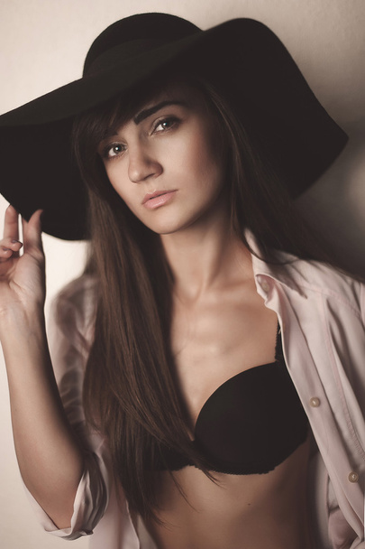 Fashion photo of beautiful lady in elegant black hat and white s - 写真・画像