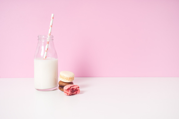 different macaroons with bottle of milk - Foto, Imagem
