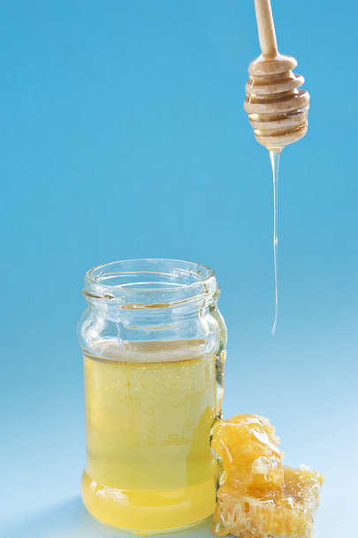 Honey in jar with honey dipper - Photo, Image