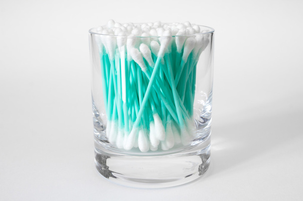 Cotton swabs in clear glass jar isolated on white - Photo, Image