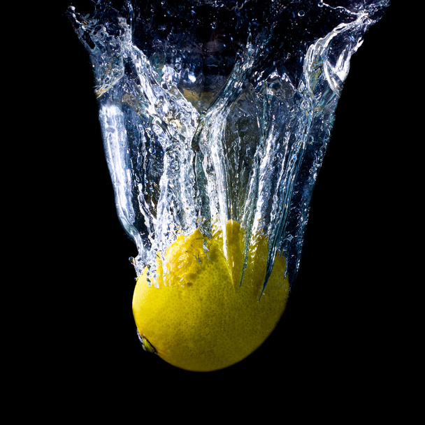 Lemon falling into water - Photo, Image