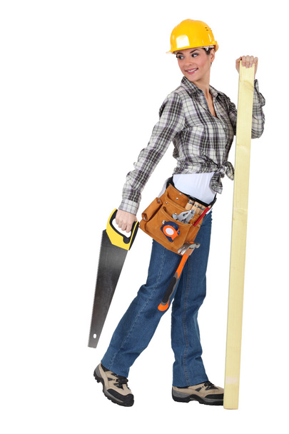 A female carpenter with a handsaw. - Фото, зображення