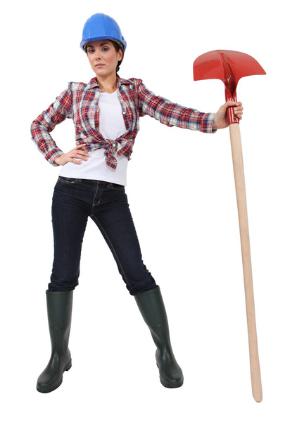 Cute female bricklayer holding shovel - Photo, Image