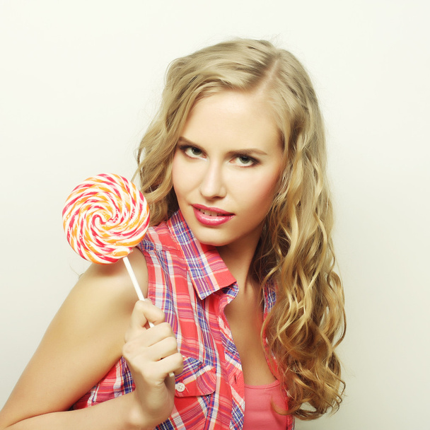 blond  girl with  lolipop - Foto, afbeelding