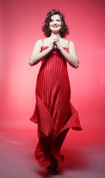 Young woman in red dress - Фото, зображення