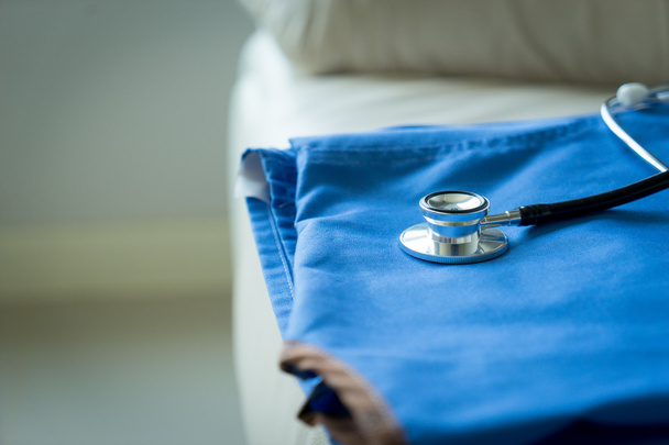 Stethoscope on nurse & doctor coat background - Фото, зображення