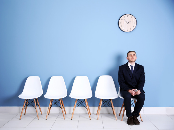 Young businessman sitting on chair - Photo, Image